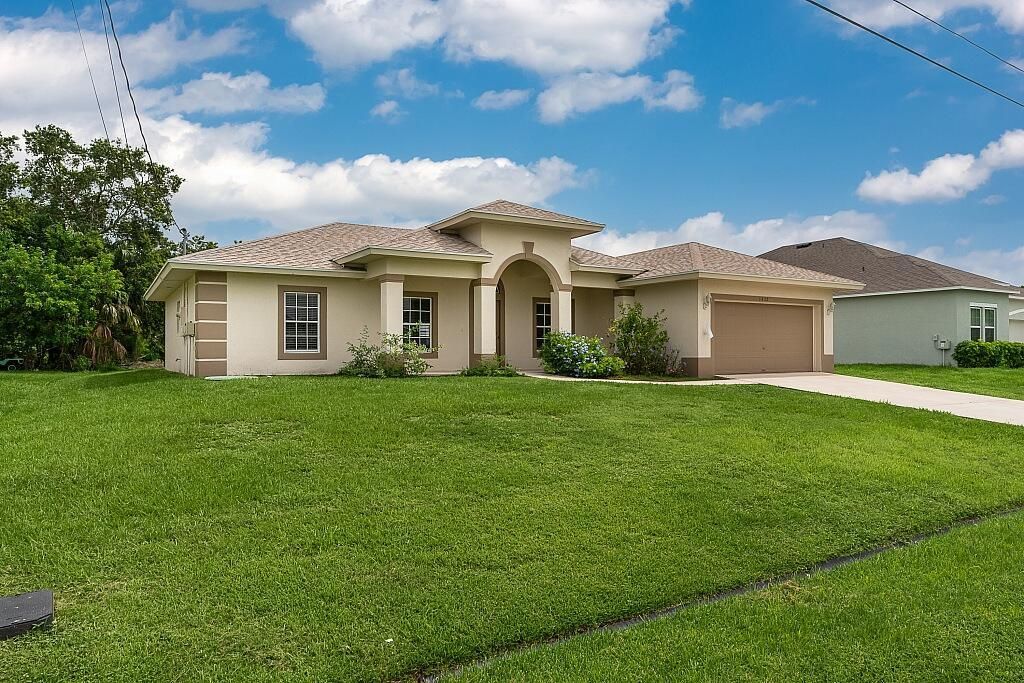 Photo of 1472 SW Falmouth Avenue, Port Saint Lucie, FL 34953 (MLS # R11004497)