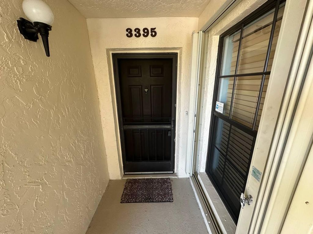 Photo of 3395 Jog Park Drive, Greenacres, FL 33467 (MLS # B26015396)