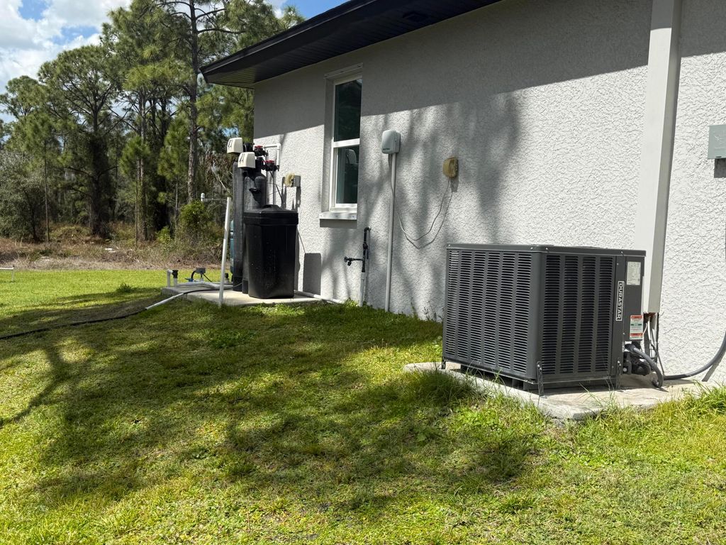 Photo of 1046 Cheney Avenue S, Lehigh Acres, FL 33974 (MLS # R11169948)