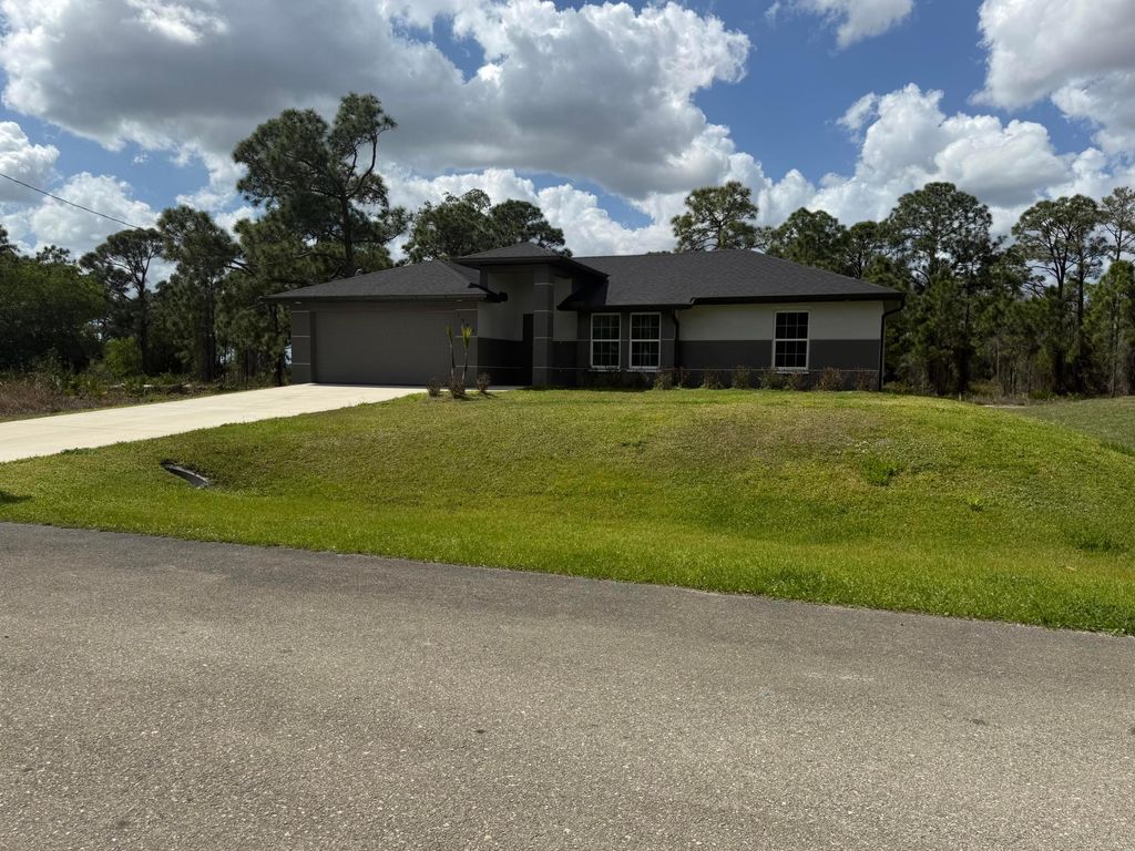 Photo of 1046 Cheney Avenue S, Lehigh Acres, FL 33974 (MLS # R11169948)