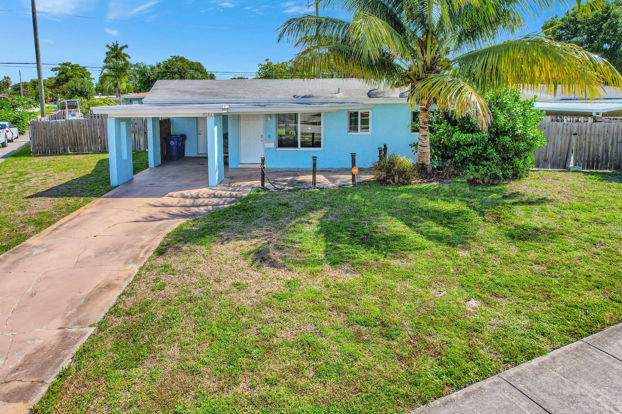 Spacious 2 bed, 2 bath home in Riverland Village, Fort Lauderdale! Located on a large corner lot, nearly 1/4 acre, this house boasts hurricane impact windows and doors, an attached carport, and multiple entrances! Enjoy terrazzo floors in bedrooms and wood plank tile in living areas. The massive backyard can fit 25ft boats on each side with space to spare. Modern kitchen and spacious living area perfect for entertaining. Conveniently located near highways for an easy commute, and a short distance to downtown Fort Lauderdale, Las Olas, and the beach! Don't miss this gem! Professionally managed property!