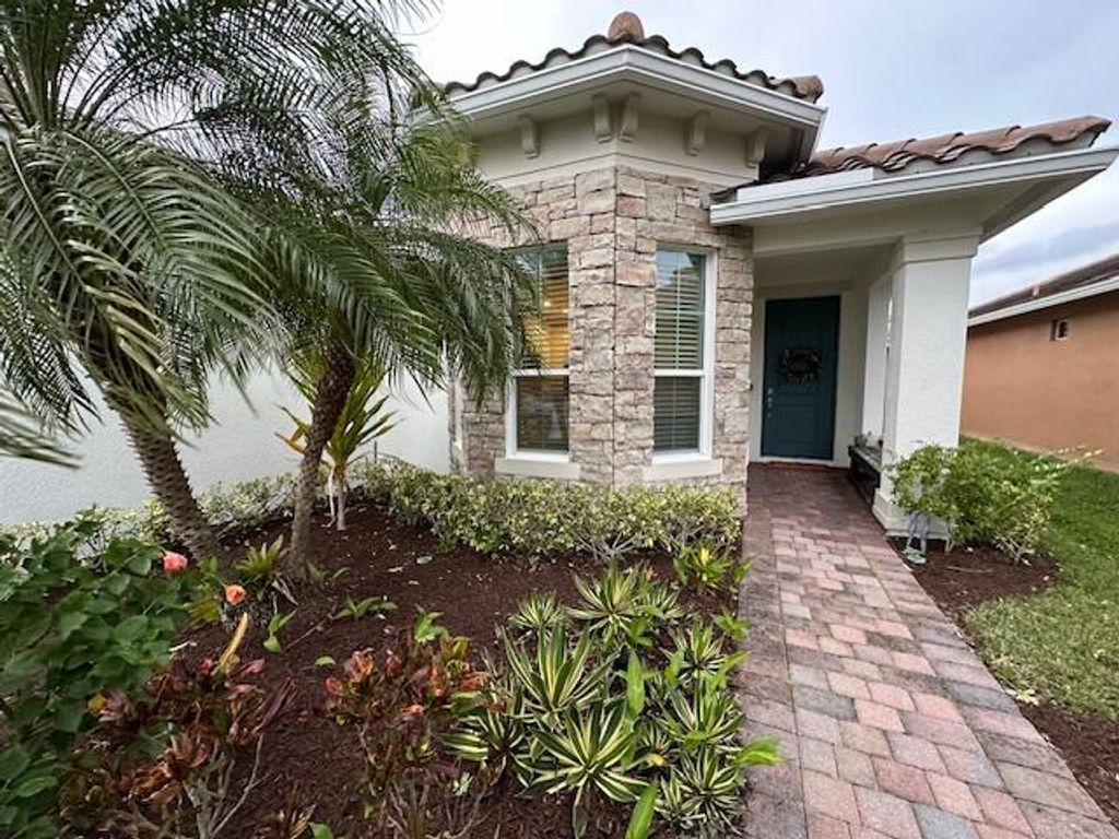 Photo of 9624 SW Royal Poinciana Drive, Port Saint Lucie, FL 34987 (MLS # R10948997)