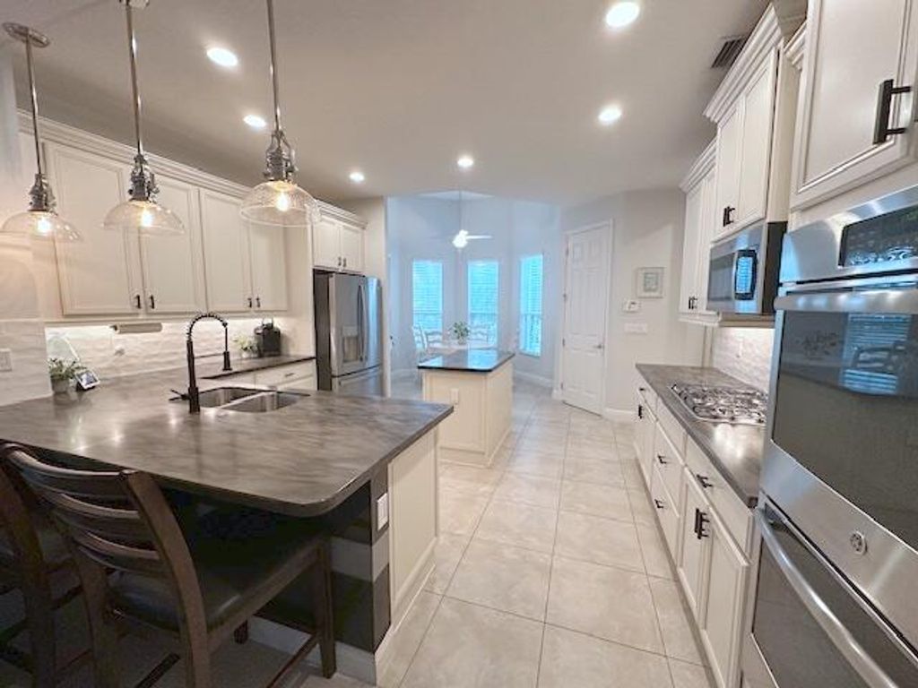 Photo of 9624 SW Royal Poinciana Drive, Port Saint Lucie, FL 34987 (MLS # R10948997)