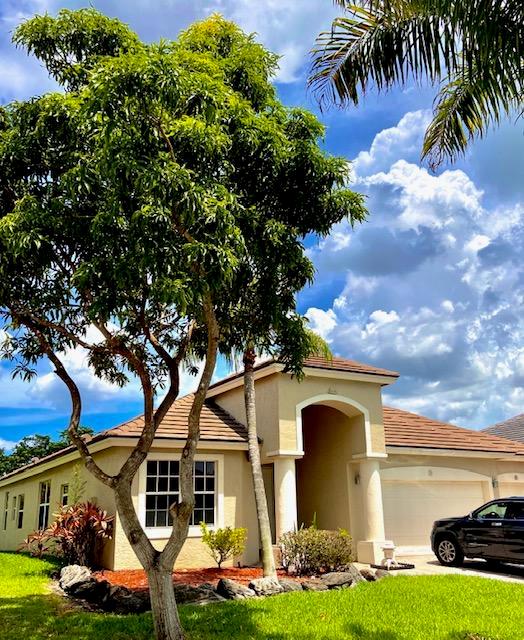 Welcome home to a beautiful home 4/3/3 residence in Boca Falls! Professional photos coming 26th. Floorplan is open concept triple split with soaring ceilings. Home was just completely painted inside with off white, and all new window treatments. Roof and AC about a year old. Owner is installing impact glass end of October. NO CARPET. Enjoy cooking on your induction cook top in the modern white kitchen with double wall ovens. The peaceful lakefront view with no rear neighbors is enjoyable. The back yard is fenced, and the community has wonderful amenities including a clubhouse, exercise facility, pool, tennis, and so much more. All information contained herein to be verified by tenant. Hurry as this one won't last! Use CDC guidelines for showing-masks, social distance and gloves.