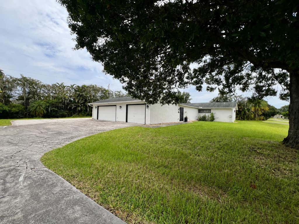 Photo of 1290 SW FLETCHER Lane, Port Saint Lucie, FL 34953 (MLS # B26058909)