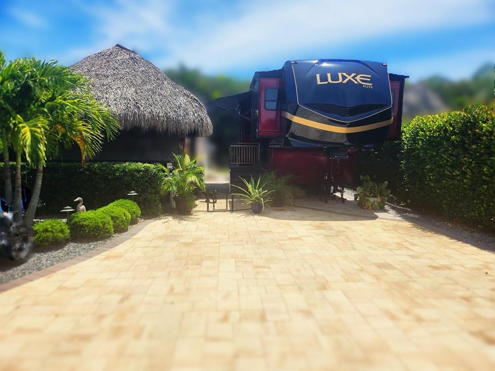 5 STAR RESORT, SILVER PALMS LOT 20. Premium spacious lot, surrounded w stable mature landscape, privacy buffer. 2021 additions, 12'x14' finished Casita, A/C, W/D included 1/2 bath. 12'x14' rugged authentic Seminole Tiki, w elect, fire pit, patio furniture, BBQ, over 1100 sf pavers, lot accommodates 60'+/-rig. Public water/sewer.
Silver Palms Clubhouse, library, pool, spa, gym, billiards, special events, activity calendar, friendly neighborhood, minutes to town, dining, shopping, walking distance to the great lake Okeechobee, fishing, boating, lounging. MOVE IN READY!
NOT INCLUDED: Custom Luxe 44' 5th wheel FL. Not a typical RV, this is a home on wheels. Luxury, 6 slides, spacious kitchen, king bdrm, out door TV. Sold together or separately call for Luxe pricing.
Unique opportunity.