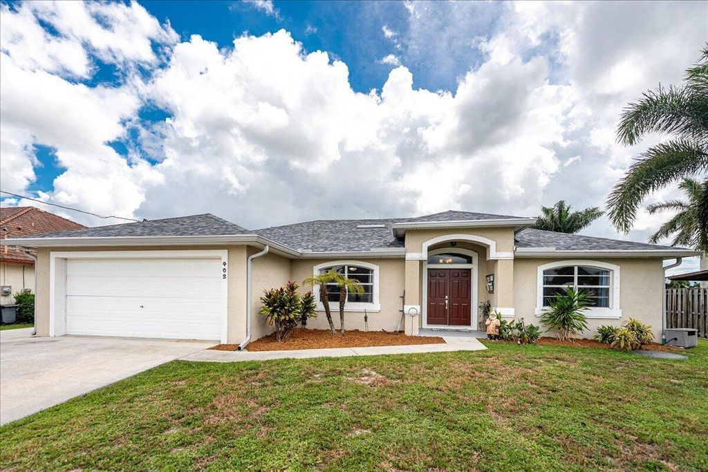 Photo of 402 SW Jeanne Avenue, Port Saint Lucie, FL 34953 (MLS # R11122937)