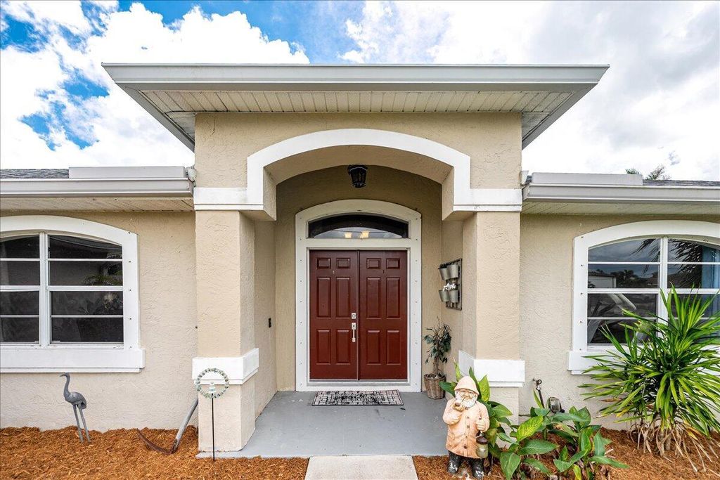 Photo of 402 SW Jeanne Avenue, Port Saint Lucie, FL 34953 (MLS # R11122937)