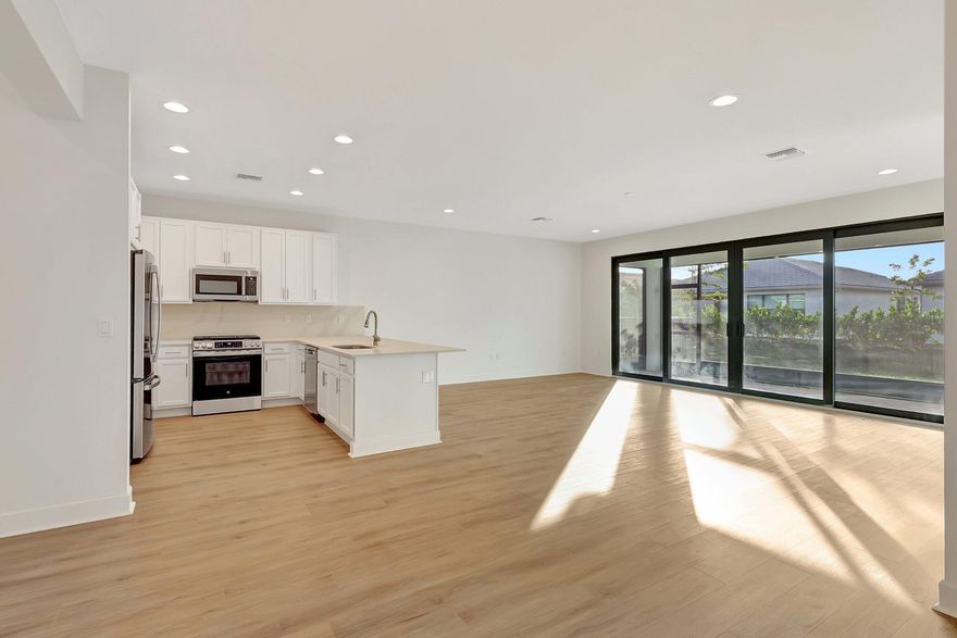 Enjoy this spectacular GL home in a premier 55+ active adult community! Sandpiper model with open, bright floorplan featuring 2 bedrooms plus den with pocket doors. Gorgeous custom upgraded kitchen with white cabinets, SS appliances, quartz counters and backsplash.  Impact windows throughout. Gas oven with grill. Spectacular high end wood looking plank flooring throughout entire house. Large master bath with glass shower doors, neutral tile, mirrors to the ceiling and double vanities. Custom modern window treatments and blinds. Private screened patio with beautiful pavers to enjoy the outdoors. Separate laundry room, 2 car garage. Enjoy resort style living at the fabulous Valencia Walk club house. World class amenities include resort style pool, restaurant & outside bar.