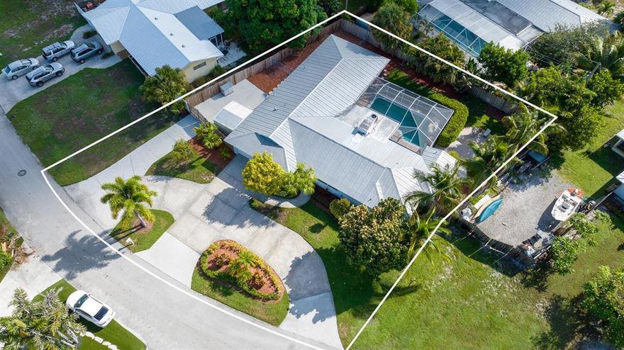 Bring Your Boat,RV,Jet Ski's & All Your Favorite Toys. There's Room For All! This 1 Story, 4 Bedroom, 3 Full Bath Split Floor Plan Pool Home Lives Large! A Rated Schools! MBR Has Full BTH En Suite & Separate 2nd Cabana Full BTH. The 2nd & 3rd Bedroom's Have Their Own Dens/Playrooms. PGT Impact Sliders Open Up To The Covered Lanai & Screened Pool Area. Plantation Shutters in Living Room & Master Bedroom, Crown Molding Throughout, Circular Driveway, Double Gate To Boat Parking Area With Convenient Entrance To 3RD Full BTH. This Home Truly Embraces The Best Of Florida Living. Just A Short Walk To The Community Dock To Unwind, Enjoy The Sun & Tranquil Water Views. Bermuda Terrace Voluntary POA Offers A Private Marina Equipped With Boat Launch, Wet/Dry Slips, Very Low Fees. See Docs for Details