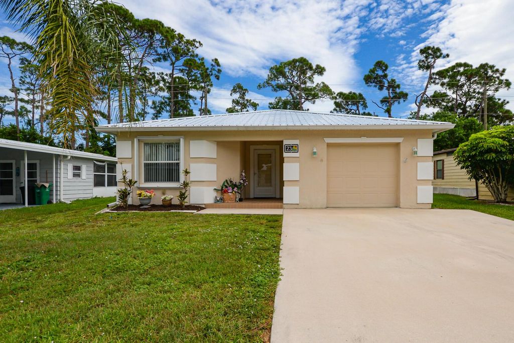 Photo of 23 La Puerta Del Norte, Fort Pierce, FL 34951 (MLS # R10911886)