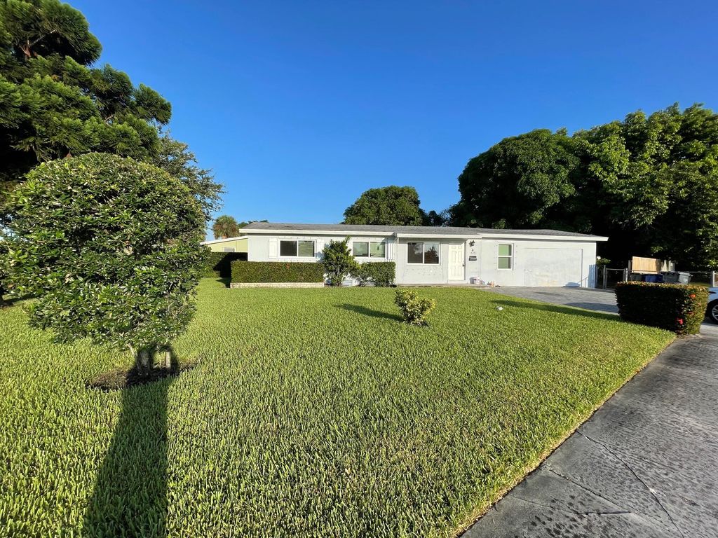 Photo of 905 Laurel Drive, Lake Park, FL 33403 (MLS # R11010721)