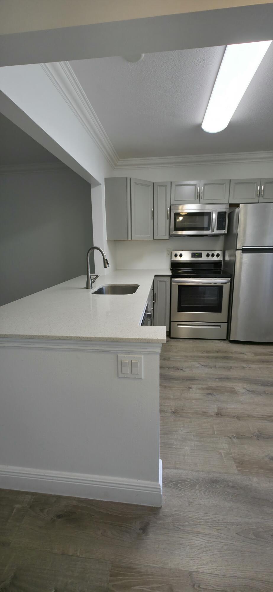 Photo of 6091 NW 61st Avenue #105, Tamarac, FL 33319 (MLS # B26007018)