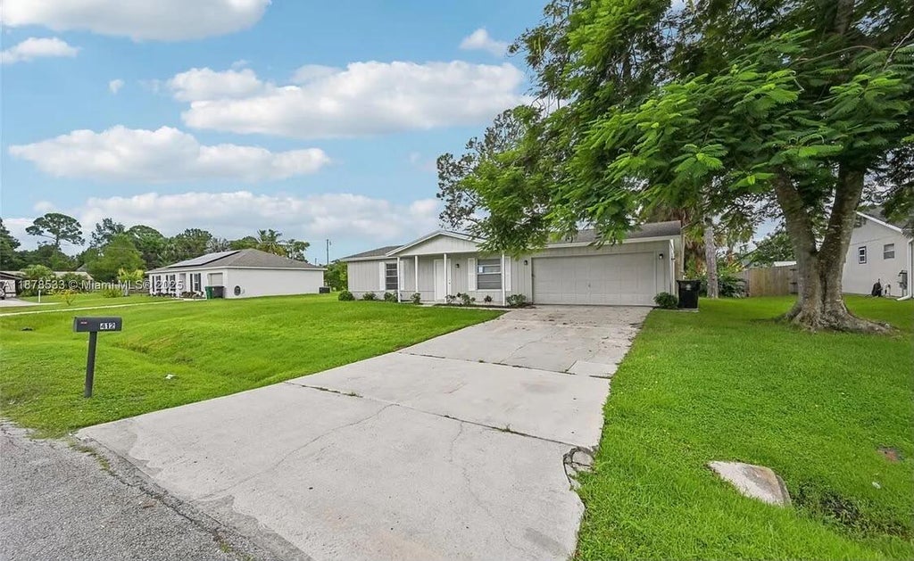 Photo of 412 NW CORNELL Avenue, Port Saint Lucie, FL 34983 (MLS # B26061815)