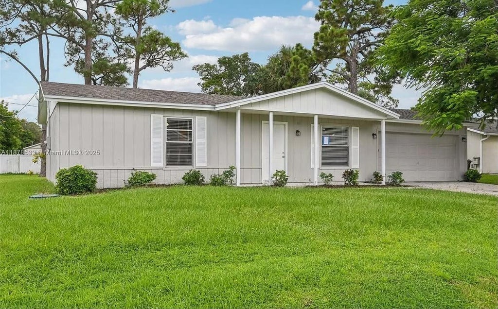Photo of 412 NW CORNELL Avenue, Port Saint Lucie, FL 34983 (MLS # B26061815)