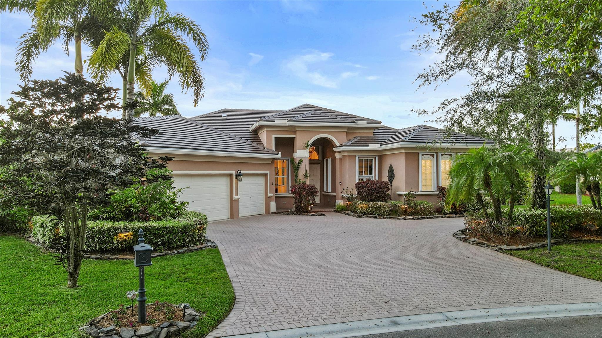 Welcome to your dream home in the prestigious gated community of Fox Ridge! This beautifully maintained 5-bedroom, 4-bathroom residence offers the perfect blend of luxury, comfort, and peace of mind with a NEW 2025 ROOF, accordion hurricane shutters throughout, and a full-house generator. Step inside to discover a spacious layout designed for both everyday living and entertaining. The heart of the home flows seamlessly into the kitchen, generous living spaces, and light-filled dining areas. Outdoors, you'll find your private oasis overlooking the lake featuring a beautifully well maintained pool, a built-in grill, and a covered outdoor bar are perfect for hosting gatherings or simply relaxing in your backyard retreat. Home is in a prime location close to top-rated schools.