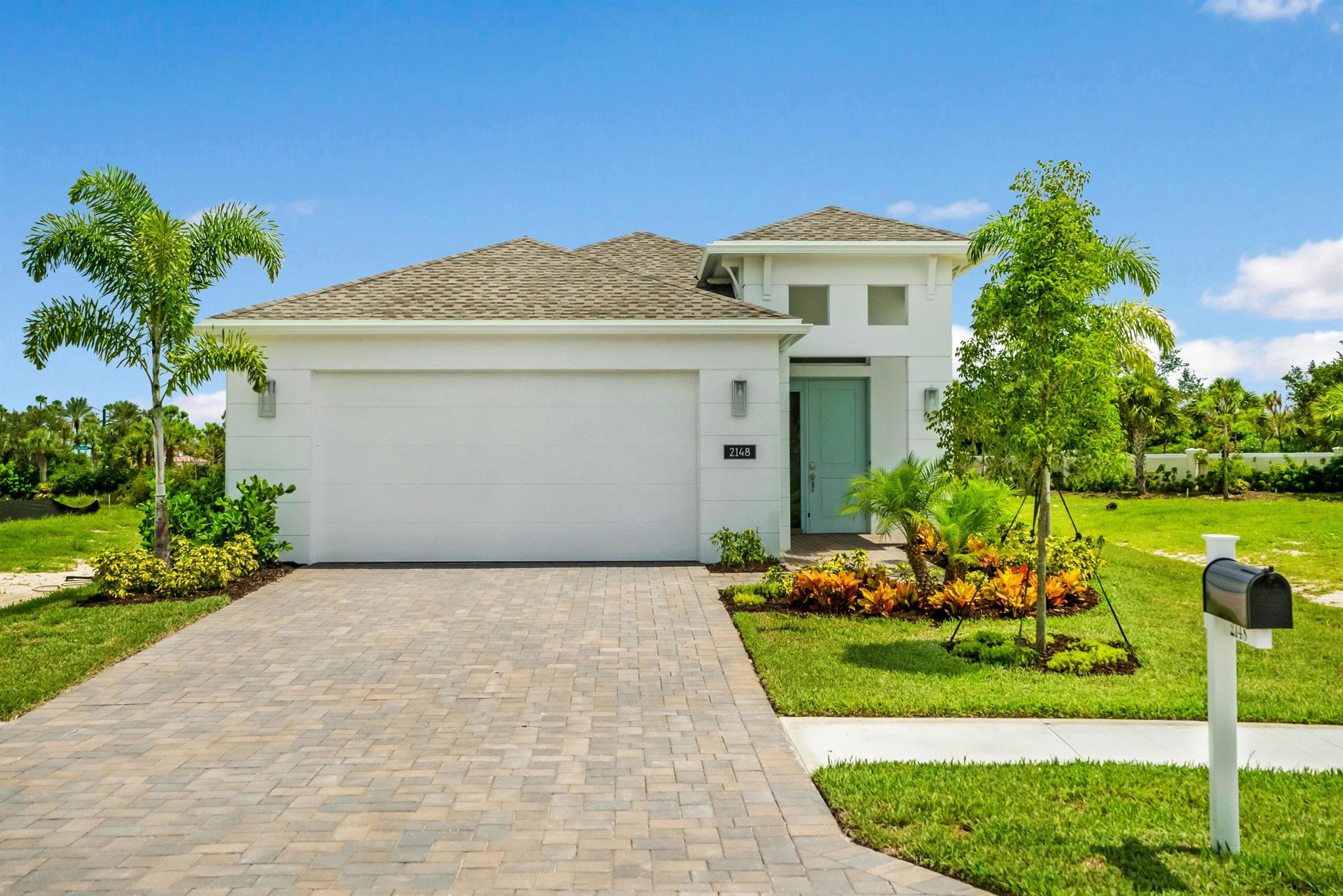This popular Mirador floor plan is located on a stunning lot with a picturesque lake view. The kitchen has been upgraded with premium stainless steel Kitchen Aid appliances, elegant white cabinets featuring soft-close doors and drawers, and luxurious quartz countertops. The entire home is adorned with porcelain plank tile floors and crown moulding in the main living areas. Solid core doors and impact-resistant windows and doors are installed throughout the home.The Master Suite located at the rear is complete with a tray ceiling and large windows to allow plenty of natural lighting. The screened-in pool and lanai are perfect for those who want to enjoy the Florida lifestyle.The Falls neighborhood offers community walkways with a bridge to an island, as well as a community pool.