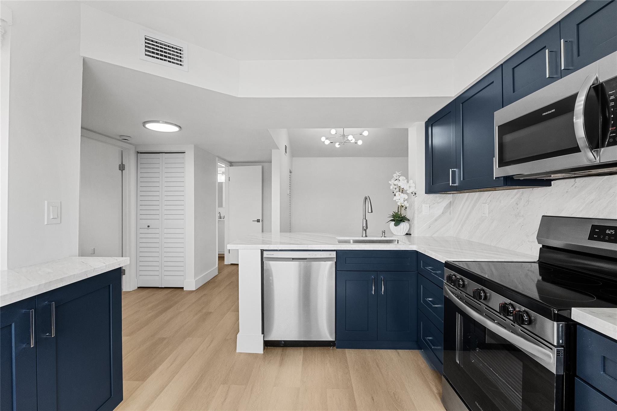 MOTIVATED SELLER! RARELY AVAILABLE COLONNADES CORNER 2/2-2ND FLOOR LAKEFRONT CONDO-SPLIT FLOOR PLAN WITH A BRIGHT & AIRY KITCHEN WITH NAVY SHAKER WOOD CABINETS AND BEAUTIFUL MARBLE COUNTERS & BACKSPLASH,NEW STAINLESS APPLIANCES & ADDITIONAL STORAGE. FRESHLY PAINTED,NEW LVP FLOORING THROUGHOUT, NEW BLINDS,FANS & LIGHTING FIXTURES, PRIMARY HAS TWO CLOSETS, BATHS ARE FRESHLY UPDATED WITH STORAGE VANITIES AND MARBLE TOPS, SEPARATE LAUNDRY AREA WITH NEW FULL SIZE WASHER & DRYER, SCREENED PATIO WITH ADDITIONAL STORAGE SPACE. 2 ASSIGNED PARKING SPACES. ACROSS FROM CENTRAL PARK & DOWN THE STREET FROM SUNSET PARK,LOCATED NEAR MAJOR HIGHWAYS (I-595,I-75 & SAWGRASS), PRIME DINING AND SHOPPING IN EVERY DIRECTION. FINANCING OPTIONS AVAILABLE. AIR BNB/INVESTORS. NO WAIT LEASING PERIOD
