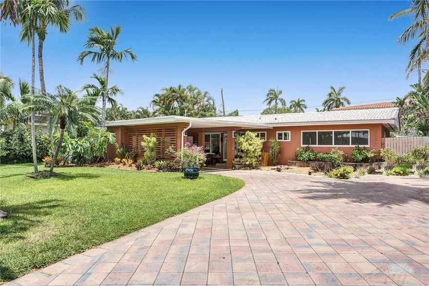 This beautiful home is located in a fantastic neighborhood convenient to everything in Northeast Fort Lauderdale/East Oakland Park. Mature tropical landscaping sets the stage. An open floor plan and plentiful impact windows and doors make this a bright and cheerful home. The kitchen includes a breakfast bar, solid wood cabinetry, granite counters and stainless appliances. French doors open to the Florida room overlooking and opening to the backyard and multiple patios. Oversized tile floor throughout. Both bathrooms have been updated. The tile roof is six years new. New dishwasher, refrigerator, washer and dryer. Two storage sheds. Room for a pool - ask for plans. 1 mile to Wilton Manors, 1.5 miles to the public beach, 4 miles to downtown Fort Lauderdale. No HOA.