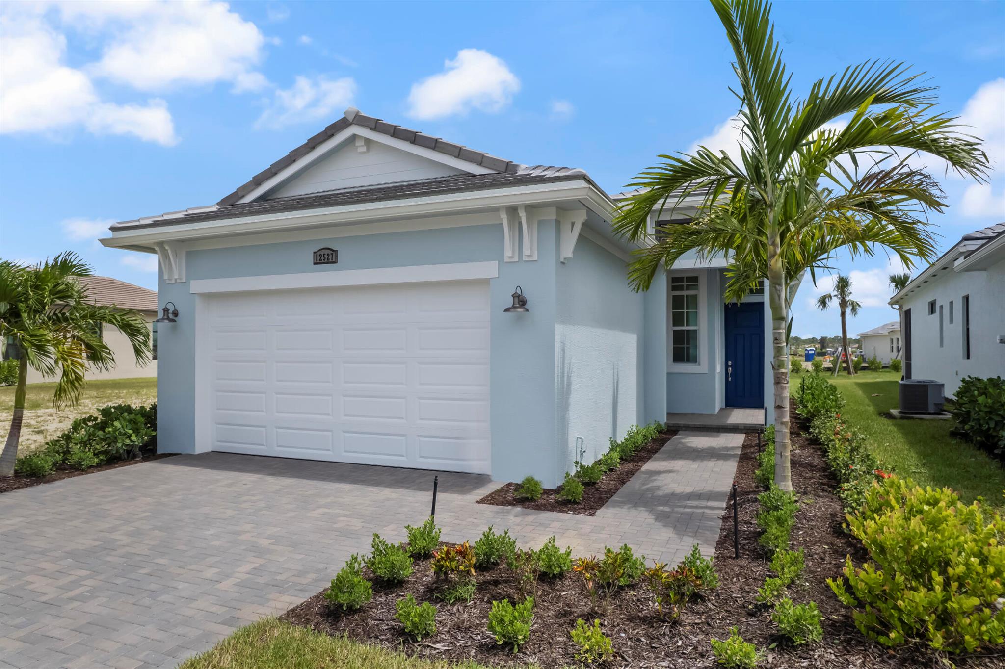 **New Construction** This new construction home featuring 3 bedrooms and 2 bathrooms with an open-concept main living area. The spacious living room includes a large triple sliding glass door that opens to a covered lanai. The Owner's Suite is located at the rear of the home for added privacy and includes a 4' extension and a frameless shower in the en-suite bath. This home also includes a 5' privacy wall and pre-plumbing for a summer kitchen, a gourmet kitchen, upgraded lighting package throughout, laminate wood flooring, and cabinetry in the laundry room. Community amenities include a grand gated entry, PGA golf membership availability, 27 pickleball courts, fitness center, and an indoor resistance pool.