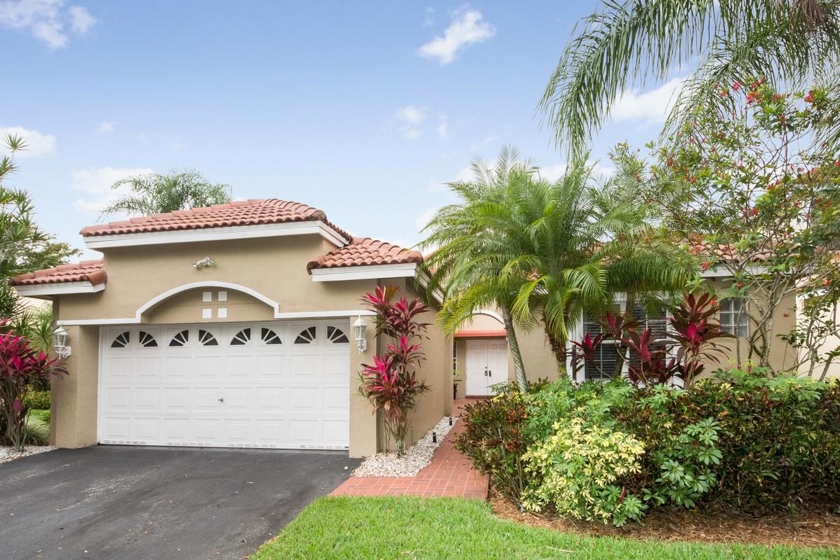 Lovely Home in Hibiscus Island. Courtyard style entrance leads into grand open living room with vaulted ceilings and gorgeous lake views. The home features two screened patios to enjoy the long lake views, a laundry room, breakfast nook, open kitchen with bar area, tile in living areas & wood flooring in the bedrooms. Community is gated & has a community pool, playground, and half basketball court. Centrally located in Weston with easy access to shopping, restaurants & the major highways.