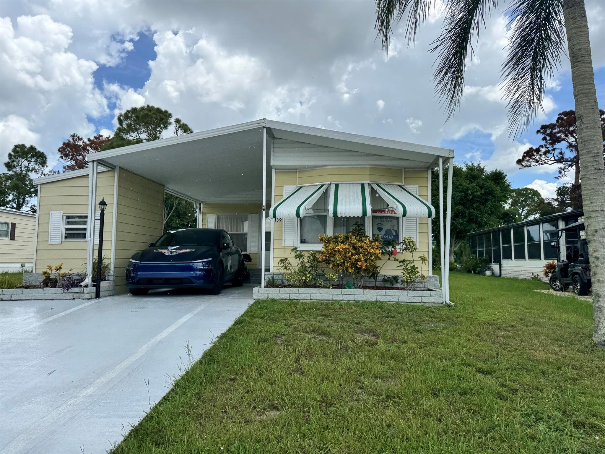 Spanish Lakes Golf Village, Acitve 55+ Community! Affordable Two Bedroom, Two Bath, Carport with large living room, and family room. Spacious kitchen w/appliances. There is a laudry room and includes washer / dryer. Large Florida room with hot tub that stays. Most furniture can be included! This is a fantastic value and very affordable! Great location just minutes to shopping and area beaches. Spanish Lakes is a land lease community with hoa/lot rent $800 per month and includes fantastic amenities! Enjoy meeting new friends and taking part in the many monthly social events hosted by the residents.