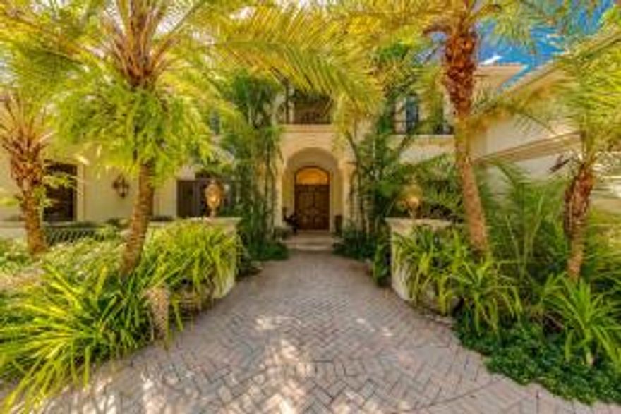 Masterful design embodies this entertaining one-level estate. At the grand arched hallway you are lead to a billiard room and a dramatic two-story library, in addition to a state-of-the-art eight-seat theater/media room. The sun-filled great room features coffered ceilings with a dramatic stone fireplace and granite-topped professional bar. The oversized formal dining room with fireplace leads through the butler area into the chef's kitchen. Richly finished wood, adorns the kitchen cabinetry and built-ins in the adjacent family room. The private master wing is a rare find that entails a palatial (hers) bathroom with a dream closet. Opposite is the gentleman's bathroom, enormous closet and private office that leads to the pool area. Outdoors, a screened in loggia with summer kitchen opens