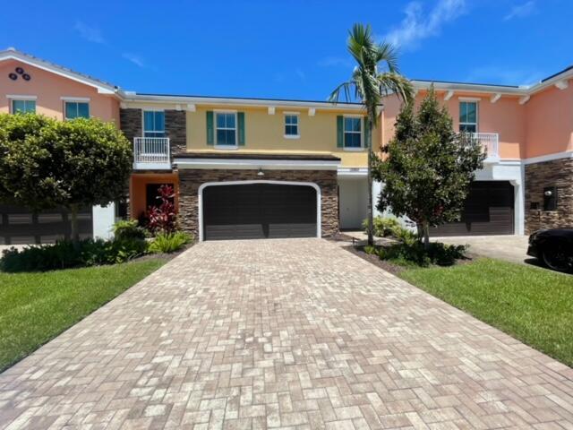August special don't miss this opportunity! Luxury Town Home thinks it's a single family home in the heart of the ''Signature'' area of Palm Beach Gardens where you are literally minuets to everything! 3 Bedrooms, 2/5 bath, 2 car garage with FULL LAKE VIEWS! Close to all major highways, entertainment, shopping, restaurants and A rated schools. Gated enclave of only 50 town homes. Hurricane impact glass, Quartz, Granite, Upgraded Cabinets, Tile on First Floor - Wood Vinyl on 2nd Floor.