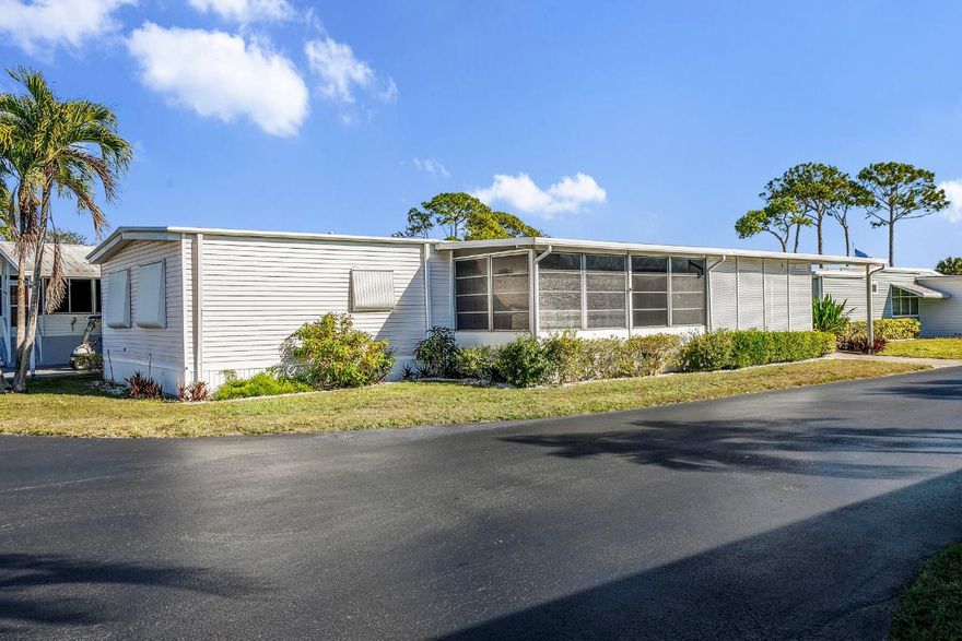 This property is an investor's dream, offering generous space and great potential. It features a living room and family room, an open kitchen with a dining area and built‑in buffet, plus two large bedrooms. The main suite includes a walk‑in closet and a roomy bath with a step‑in shower, while the guest room offers ample storage and guest bathroom has a tub/shower combo. Enjoy both a screened patio and a covered outdoor area. With two storage sheds, indoor laundry, and the possibility to convert to a three bedroom, this home has endless possibilities.   This is a gated community with a low monthly fee.  NO Land Lease.  Active clubhouse with heated pools, pickle ball, shuffleboard, bingo, cards, dances and so much more.  Close to plenty of shopping and dining and local beac