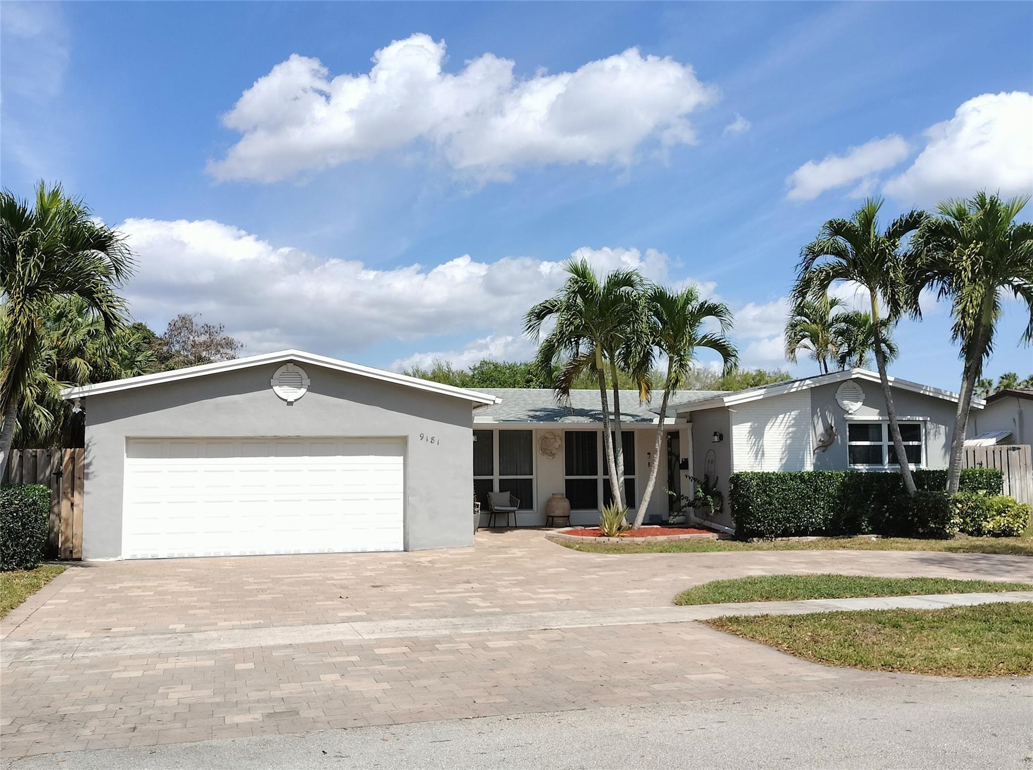 HUGE 3458 SQ FT REMODELED 4 BED WATERFRONT HOME WITH 2 CAR GARAGE. LOW $ PER SQ FT PRICE FOR AN UPDATED HOME! RARE TO FIND A HOME OF THIS SIZE IN AREA. NEW MODERN KITCHEN WITH LARGE ISLAND, QUARTZ COUNTERTOPS & DARK STAINLESS APPLIANCES. WATER VIEWS FROM ALL LIVING AREAS. GREAT OUTDOOR LIVING--41 FT COVERED PATIO PLUS 17 FT CONCRETE PAVERED DECK, POND, PLUS FIREPIT. THIS HOME WAS MADE FOR ENTERTAINING. SPRAWLING TRI-CANAL VIEWS LOCATED ON APPROX 85 FT SUPER WIDE CANAL. KIDS WILL LOVE THIS HOUSE! BRING YOUR KAYAK, CANOE, ETC. NEW ROOF 2021, NEW AC 2020, HURRICANE IMPACT WINDOWS 2021, NEW LVP FLOORS, NEW CIRCULAR PAVERED DRIVEWAY 2022 PROVIDES LOTS OF PARKING. TOP RATED COOPER CITY SCHOOLS. WALK TO PIONEER MIDDLE SCHOOL, COOPER CITY HIGH SCHOOL & AREA PARKS.