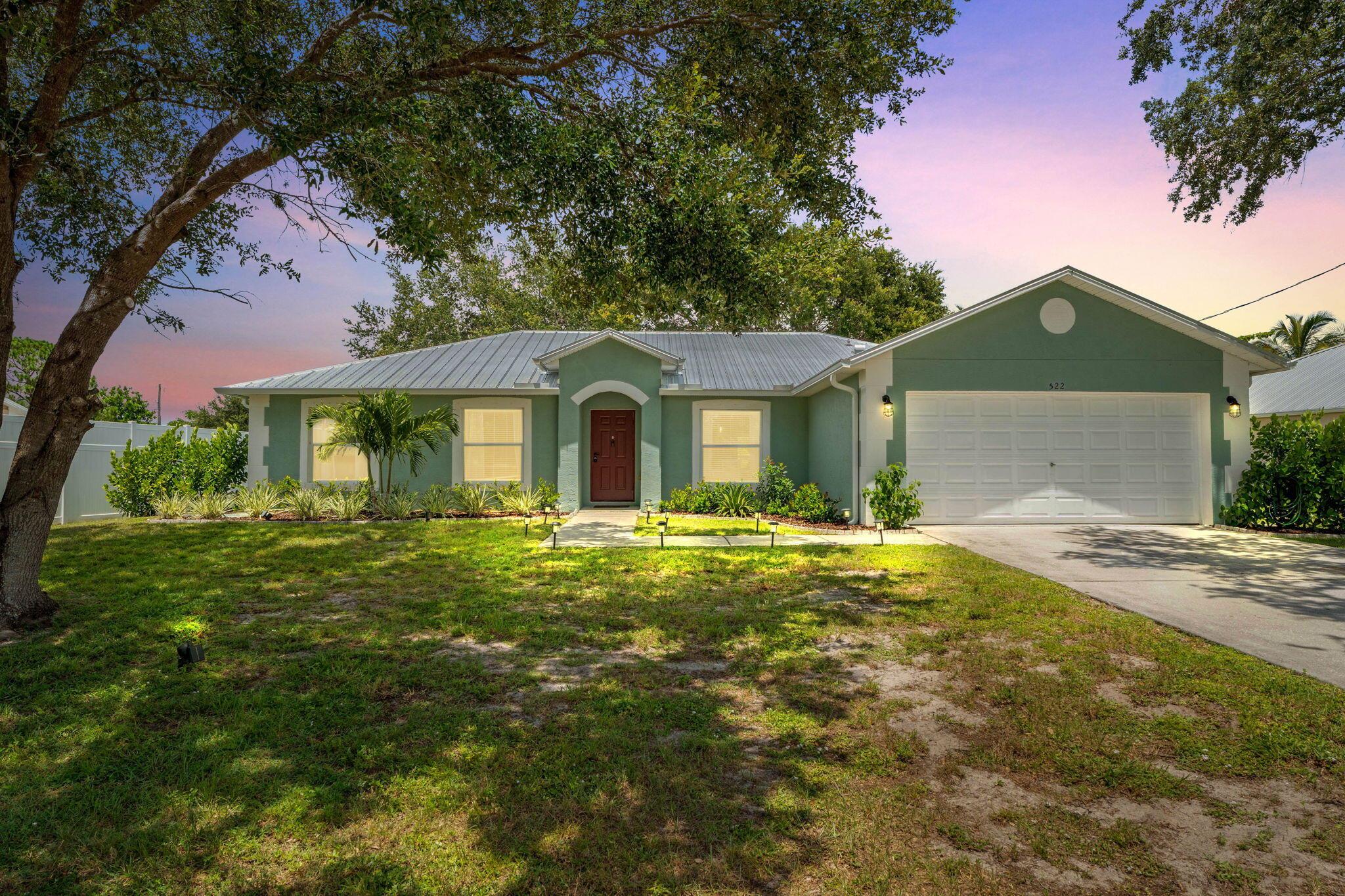 MOST convenient place to live in Port Saint Lucie. Minutes away from I95, the Turnpike, grocery stores, and restaurants. Oversized 1/3 acre lot, HUGE FENCED back yard on the canal with privacy fencing and landscaping. Spacious, split floor plan with 4 bedrooms and 2 full baths. Formal dining space, bar counter in kitchen, open living space, new light fixtures, and well maintained home. In unit washer and dryer, tile flooring throughout, plenty of storage space! Pet friendly & flexible move in date!! Furniture NOT included...home will be empty/unfurnished upon move in!