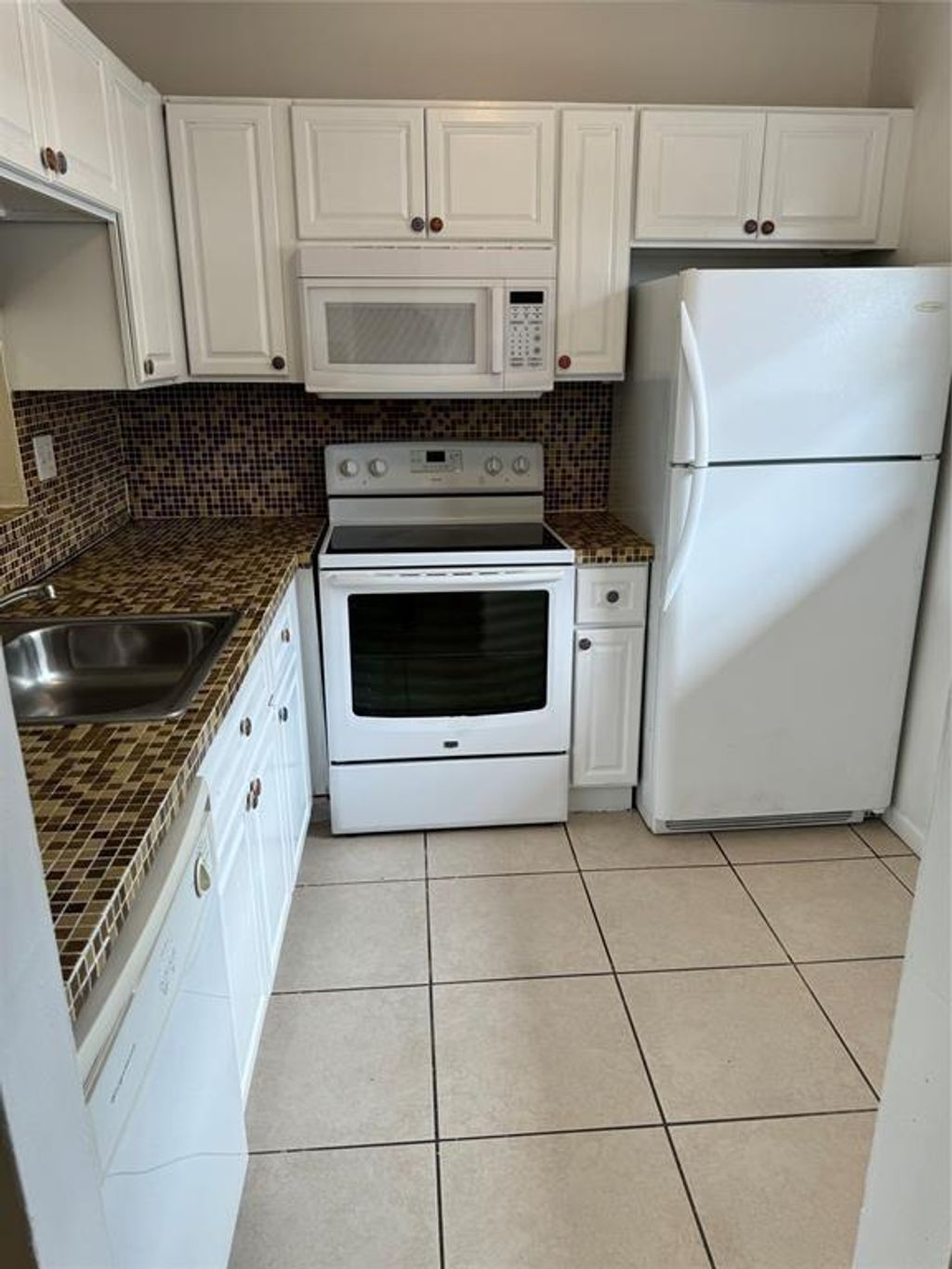 Photo of 5021 W Oakland Park Boulevard #105, Lauderdale Lakes, FL 33313 (MLS # F10489506)