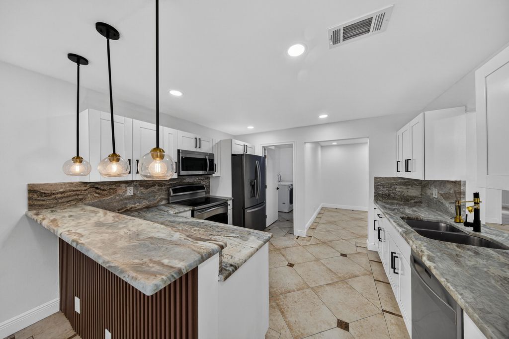 Photo of 6194 Laurel Lane #C, Tamarac, FL 33319 (MLS # B26013019)