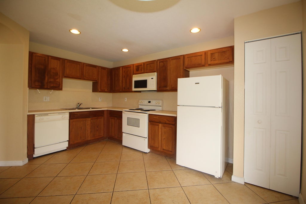 Photo of 6602 Sandy Bank Terrace, Riviera Beach, FL 33407 (MLS # B26079930)