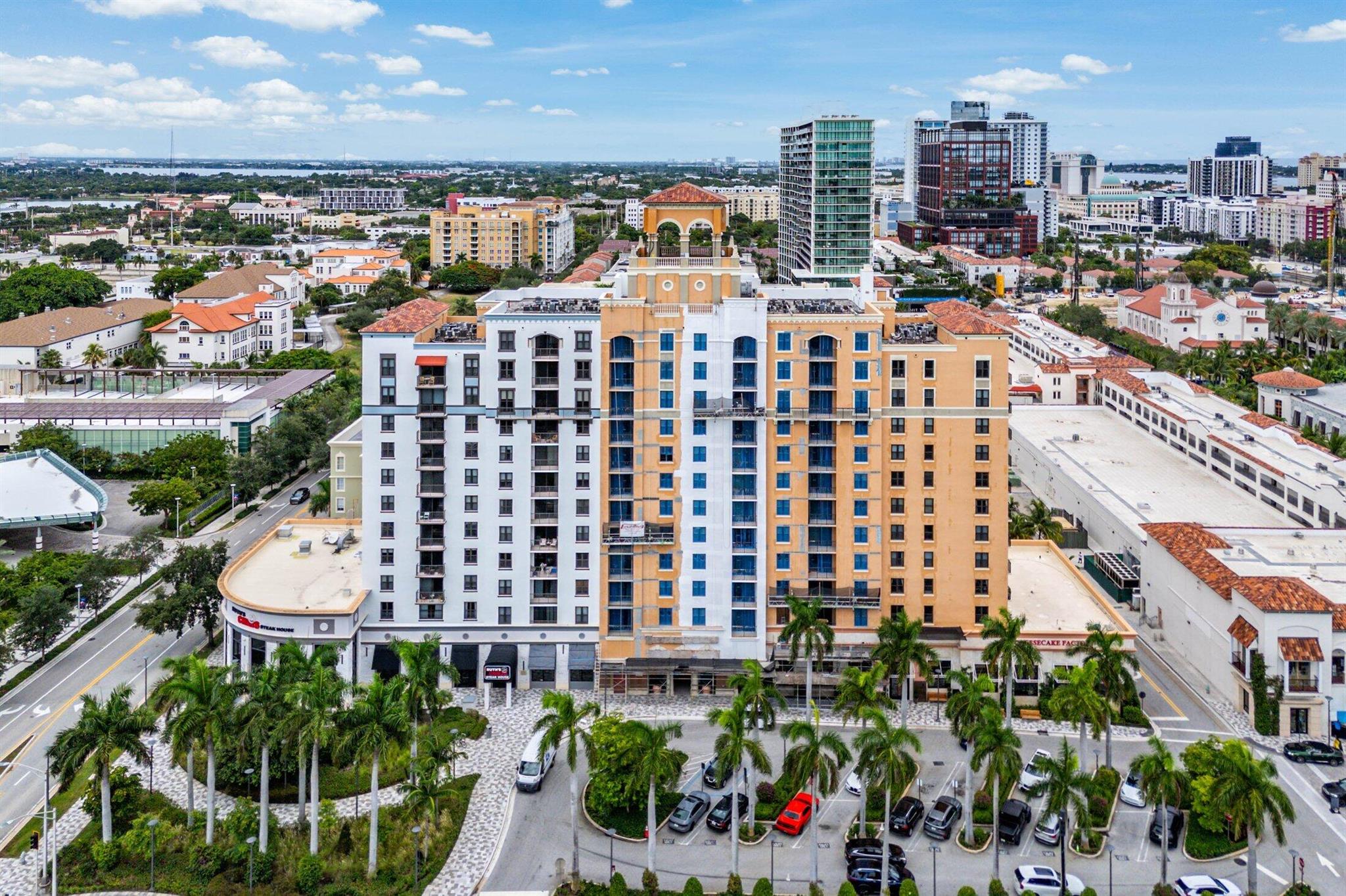 Experience elevated living in this incredible penthouse condominium, perfectly positioned in the heart of CityPlace--West Palm Beach's most vibrant destination to live, work, and play. This stunning residence showcases breathtaking city views, complemented by elegant tile flooring throughout, a thoughtfully updated kitchen and baths, and impact glass for added peace of mind.The gourmet kitchen is a chef's dream, featuring granite countertops, a stylish breakfast bar, sleek European-style cabinetry, and crown molding that flows seamlessly into the spacious living areas with soaring 9-foot ceilings. Every detail has been designed for comfort and style, from the refined finishes to the open layout that invites both relaxation and entertaining.