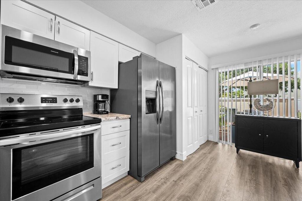 Photo of 6359 Riverwalk Lane #6, Jupiter, FL 33458 (MLS # R11112029)