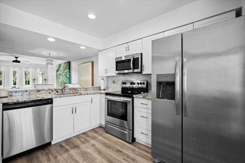 Photo of 6359 Riverwalk Lane #6, Jupiter, FL 33458 (MLS # R11112029)