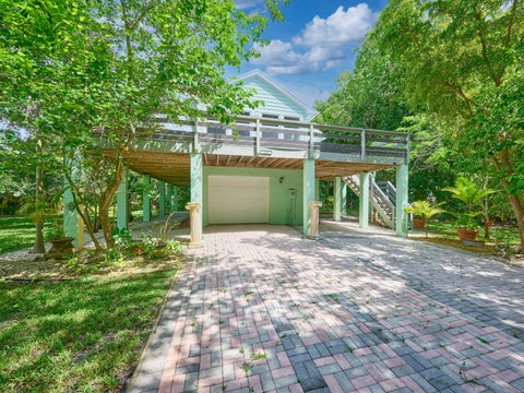 Photo of 1398 SW PALM CITY Road, Stuart, FL 34994 (MLS # B26080543)