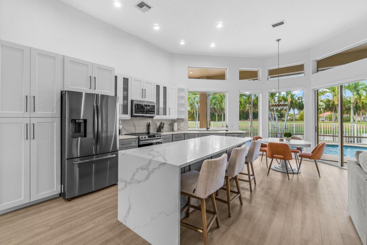 *Only available until December 2023 and after April 2024* FULLY FURNISHED TURNKEY! Beautiful 4 bedroom/3.5 bath home with NEW HEATED POOL in the heart of Equestrian Wellington and a short golf ride away from all WEF activities. Home located across from the Wanderers Club with expansive Lakefront and Golf views. This fully furnished home includes anything you might need for a relaxing extended stay. Featuring a gorgeous entertainment and outdoor dining area. Newly remodeled kitchen and bathrooms, new appliances, custom blinds throughout and all new furniture.