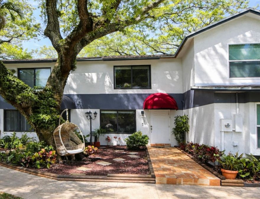 Welcome to 3441 Oak Drive, a rare find in the desirable Tamerlane community of Hollywood, FL. Located across from TY Park, this updated 2-bedroom, 2.5-bathroom townhome offers easy access to major highways, the Hard Rock Hotel and Casino, and nearby shopping, dining, and places of worship. Inside, enjoy a bright, open layout filled with natural light. The modern kitchen features granite countertops, stainless steel appliances, and sleek cabinetry. Recent upgrades include new impact windows and doors, a 2025 roof, newer AC, and a 2024 water heater. Additional highlights include a state-of-the-art washer and dryer, vaulted bedroom ceilings, ample storage, and a beautiful backyard oasis. Low $200 HOA with rentals allowed. Move-in ready.