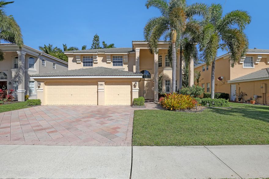 Top rated school zone, Gated community, Beautiful 5 BR/4 BA house with a pool. Italian porcelain wooden plank covers main level floor and stairway, the bedroom with full bathroom on the first floor can be used for office or guest stay. The kitchen is equipped with granite countertop, subway title backsplash and stainless steel, two French doors give you an easy access to the paved patio and pool area with a cabana bathroom. Owner's suite and 3 other guest bedrooms are upstairs. Master bathroom has double sinks, a shower and a Roman tub. Master bedroom is connected with a spacious walk-in closet and a French door to the balcony overlooking the pool. Club house has pool/spa, basketball, tennis, fitness center and others. Use Main gate at Hypoluxo road for showing entrance.