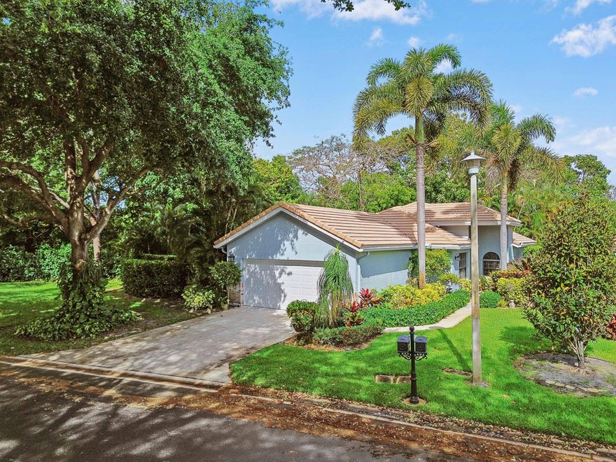 PRICED TO SELL! This 3-bedroom, 2-bath corner home with a private driveway 2-car garage is just minutes from downtown Delray Beach and the sandy beaches. Featuring high ceilings, an abundance of natural light streaming through expansive windows and beautifully updated Mocha porcelain tile flooring throughout that provides a warm, earthy aesthetic feel, it's like a private sanctuary. The modern kitchen featuring Calacatta white and gold quartz waterfall countertops paired with sleek stainless steel appliances, perfectly blending style and functionality. Bright and inviting throughout, the refreshed bathrooms add a contemporary vibe to complete the picture. The master bedroom offers a tranquil retreat facing the lush garden.  Step outside to your oversized fenced yard, a true oasis designed for both relaxation and entertainment. From the cozy fire pit to the zen-inspired patio, this outdoor space is perfect for hosting gatherings or simply unwinding in peace. The gated community offers 2 heated pools, a fitness center, tennis and pickleball courts, a bocce court and a jacuzzi, all nestled under a stunning canopy of oak trees. Combining comfort, convenience, and tropical charm, this home is more than a home- it's a lifestyle. Don't let this slice of paradise slip away. Schedule your private tour today and start living! All age community - pet friendly, low HOA!  Delray Beach, Florida, isn't just a destination, it's an experience. Proudly celebrated as the "Most Fun Small Town in America" by Rand McNally and USA Today, this vibrant coastal gem offers something for everyone. With its award-winning, crystal-clear "Blue Flag" beaches, lively Atlantic Avenue brimming with upscale shops and eclectic nightlife, and a charming, walkable vibe, with a small town feel, Delray Beach perfectly blends relaxation and energy. Whether you're soaking up the sun or exploring the buzz of downtown, this city effortlessly delivers the ultimate blend of leisure and excitement.
