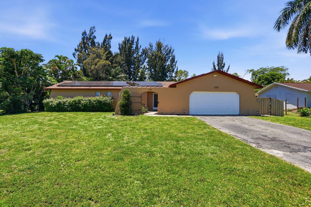 Photo of 128 Barberton Road, Lake Worth, FL 33467 (MLS # B26022737)