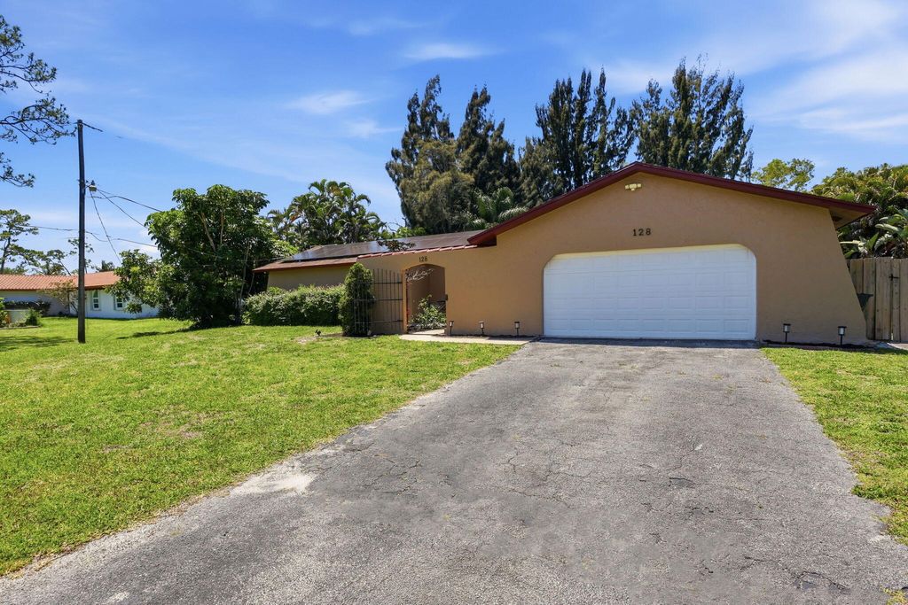 Photo of 128 Barberton Road, Lake Worth, FL 33467 (MLS # B26022737)