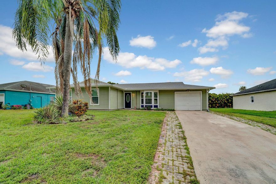 The search is over - come fall in LOVE with this 3 bedrooms, 2 bathrooms, flex room and HUGE Florida room with french doors leading to the covered screened in patio with a pool! UPGRADES include: 2024 roof (transferable warranty), impact windows, open kitchen with granite counter tops, pool pump, and updated bathrooms. Sellers are offering credits. The home is centrally located in Port St. Lucie close to the Florida Turnpike, beaches, Pioneer Park,  beaches and so much more!