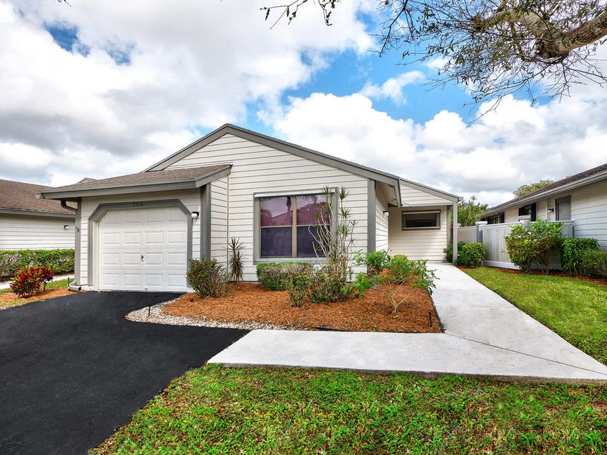 BEST LOCATION IN THE CENTER OF WELLINGTON ON QUIET CUL-DE-SAC WITH LOVELY VIEWS OF WATER AND GOLF. NEWER ROOF, NEW AC IN 2011. NEW HOT WATER HEATER 2013. EXTERIOR PERFECTLY MAINTAINED. COMMUNITY IS REPAINTING ALL HOMES THIS WINTER. SHORT WALK TO HEATED COMMUNITY POOL.