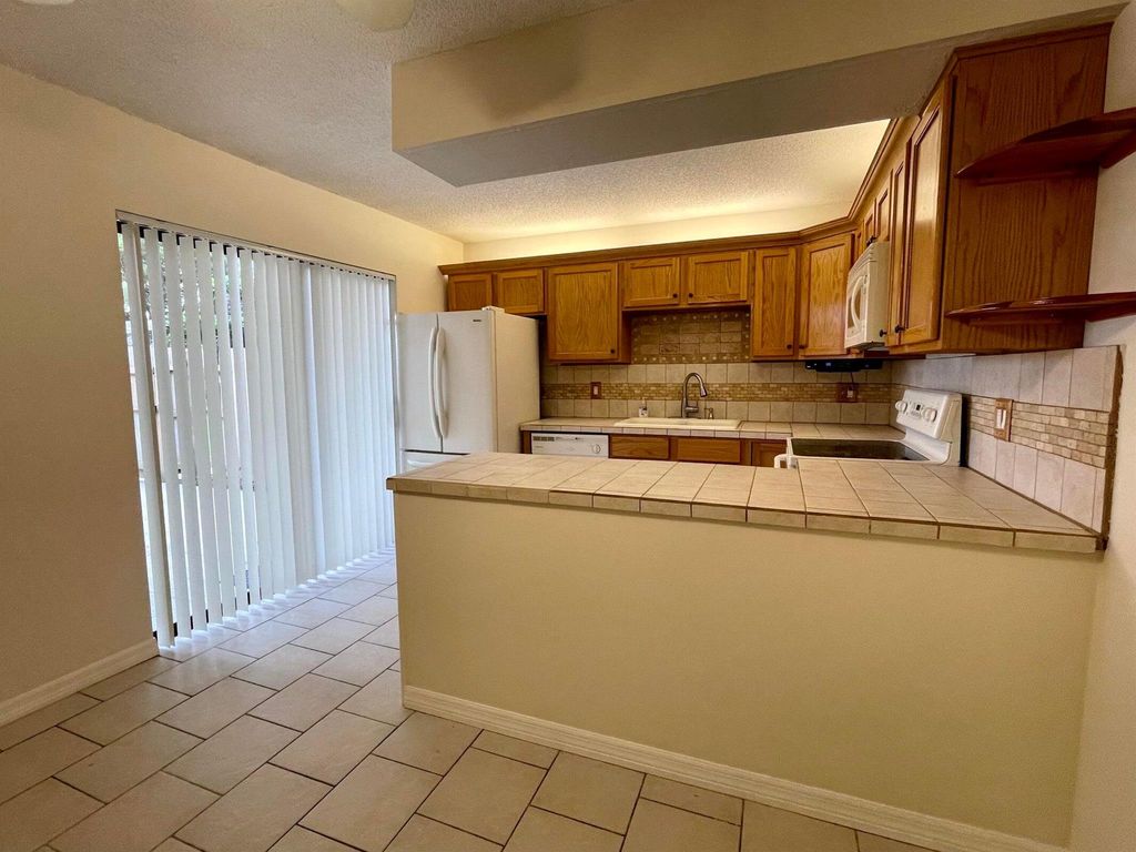 Photo of 238 Lake Arbor Drive, Palm Springs, FL 33461 (MLS # R10941316)