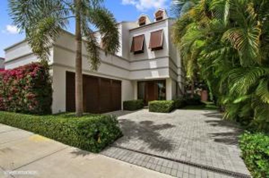 A hidden gem right in the middle of town on a quiet street. Recently completed new construction (2012), this lovely, dramatic and timeless contemporary 3 bedroom, 3.5 bath Jacobsen-inspired townhome features Brazilian Cherry hardwood and honed marble floors throughout. High ceilings, voluminous spaces and perfect flow for entertaining or daily living.  State of the art gourmet kitchen, washer/dryer, top-of-the-line elevator, 2 car air conditioned garage, imported highest quality fittings and fixtures. Oversized master suite with his and hers closets and dressing.  Two additional guest rooms with beautifully appointed baths and generous closets.  Impact glass throughout, Highest quality German made Brazilian cherry disappearing doors reveal the protected outdoor entertaining area, including