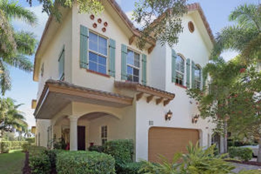 This beautiful 3-story Vespucci model townhome is located in the gated intracoastal community of The Estuary.  There are endless water views from multiple balconies with over 3100 square feet of luxury living.  We begin our tour in the grand 3 story foyer with wrought iron staircase, rich hardwood floors, volume ceilings and crown molding throughout and continue through the arched hallway to the wonderful living room and dining room.  The well-appointed kitchen will delight any chef- granite counters and backsplash, wood cabinets, and breakfast nook.  Entertaining and relaxation is the name of the game.  Enjoy your morning coffee in the screened patio and your relaxing glass of wine outdoors on the tropical patio soaking in the breezes and watching the sunset over the intracoastal.