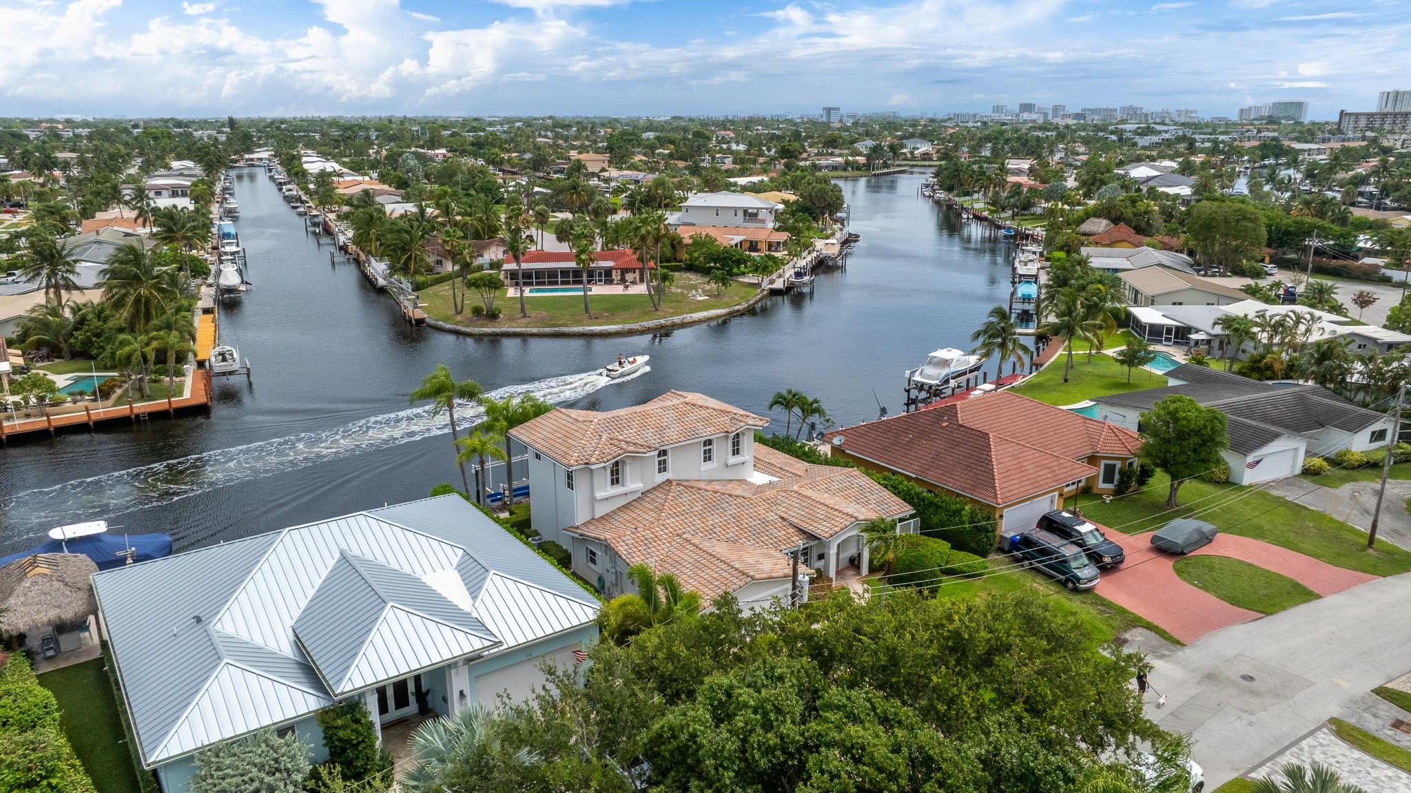 Imagine waking up to colorful sunrises & sparkling water views every day! This beautiful 4/3, 2 car garage, waterfront home, completely rebuilt & expanded in 2010, sits at an intersection on the wide Cypress Creek Canal, offering incredible vistas from every angle. The 1st floor is perfect for relaxing & entertaining, with a Great Room, & a generous waterfront Florida Room & an expansive, open Kitchen featuring a convenient Snack Bar. You'll also appreciate the 3 Bedrooms on the mainlevel, including one that's currently an office & Primary Suite #1. Upstairs, is your luxurious private retreat! The 2nd Primary Bedroom Suite features a cozy Sitting Room with a Breakfast Bar, & access to a fantastic wrap-around Balcony offering breathtaking, water views from every angle. Come fall in love!!